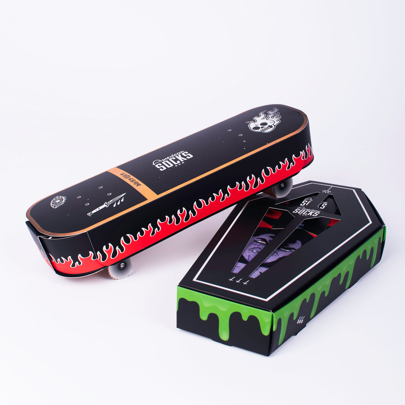 Skater themed giftbox on top of halloween themed giftbox on a white background american socks