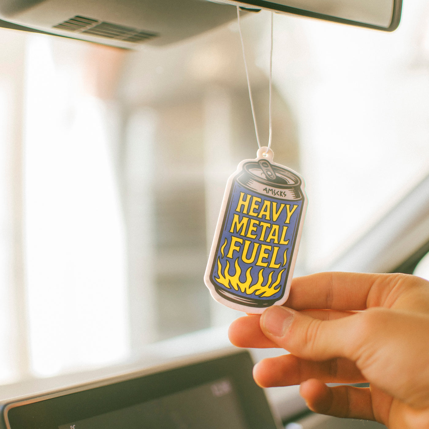 Air freshener beer can with 'Heavy Metal Fuel' text american socks