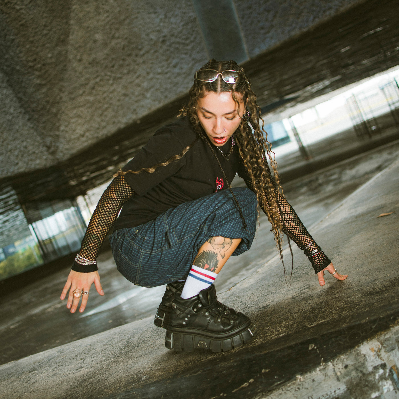 Woman posing with alternative streetwear clothing and cool ankle socks by american socks